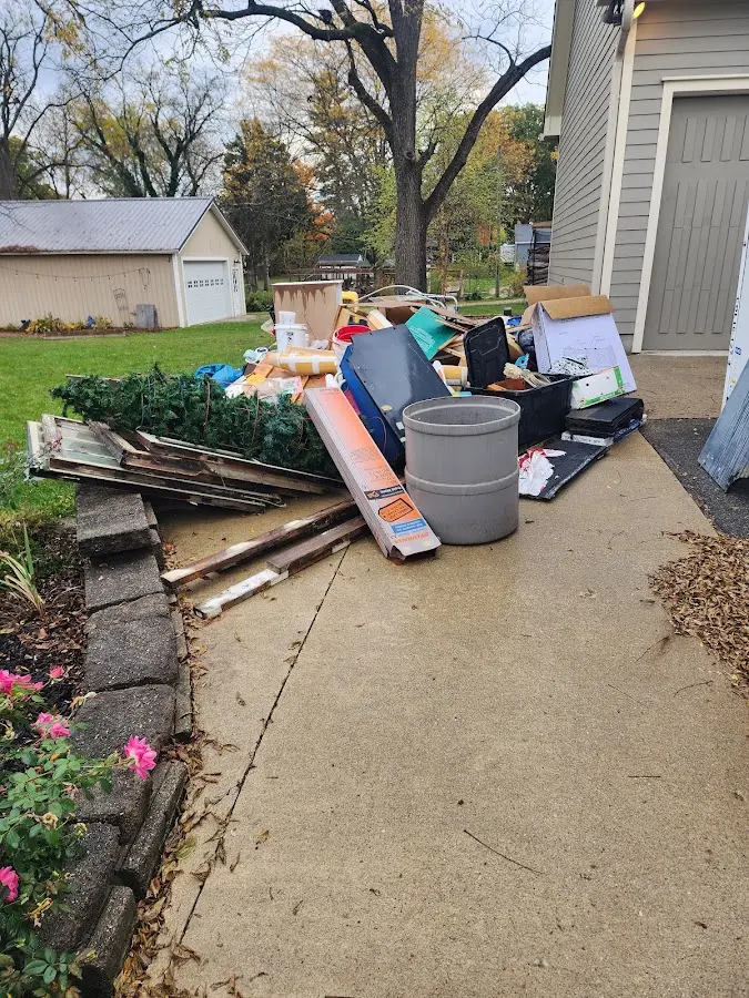 Dumpster being loaded with debris for Residential Dumpster Rental in Gautier